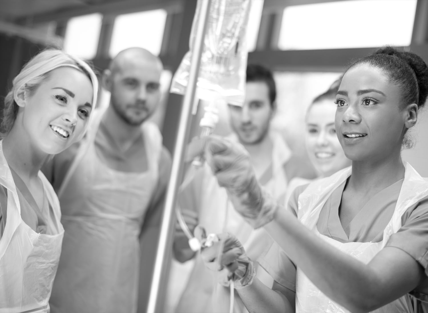 Medical professionals looking ate an IV bag